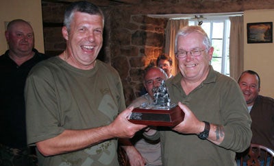 Stu presents Graham with the trophy