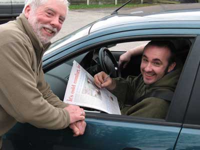 Lee autographs his article for John